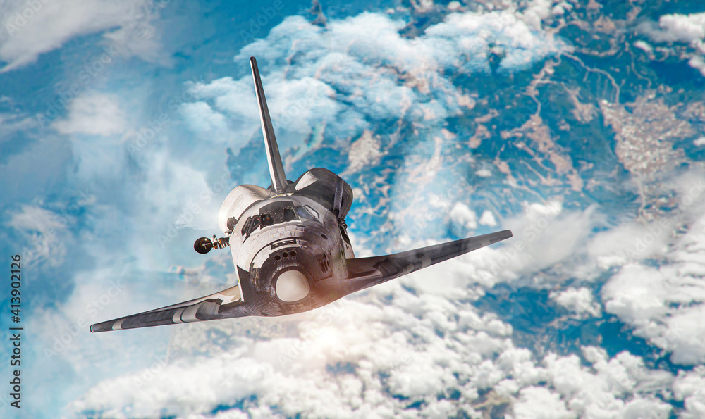 Wall mural spaceship in the sky on orbit of earth planet. view from space on space shuttle and clouds. continen