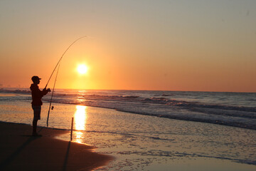 fishing at sunset