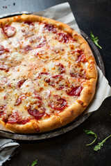 pizza pepperoni or salami meat sausage and double cheese fast food Takeaway ready to eat on the table meal snack outdoor top view copy space for text food background rustic image