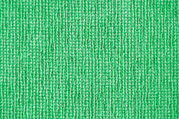 Fabric texture for background and design of artwork, beautiful crumpled pattern of silk or linen. A piece of crumbling cloth. Striped and green grass tissue