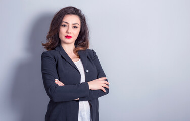 Young caucasian business woman isolated on grey background