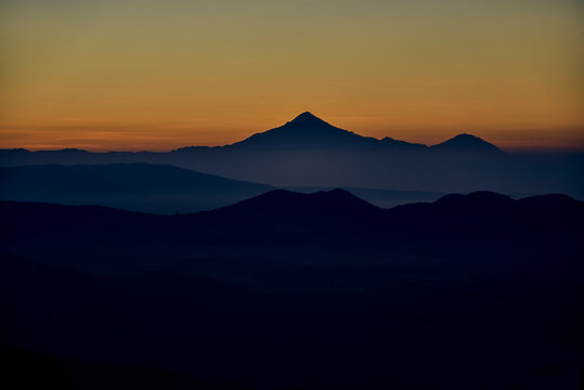 Golden sunrise in the valley with the volcan Pico de Orizaba as a watc