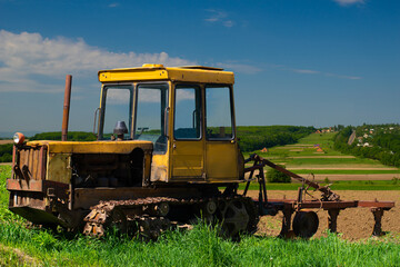 An old tractor standing on the field