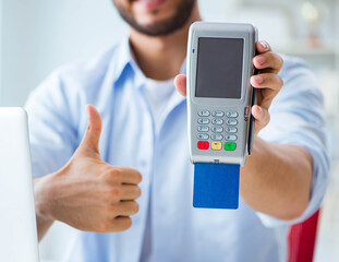 Man processing credit card transaction with POS terminal