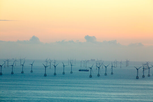 An offshore wind farm and gas platfroms in morecame bay from the summit of Black Combe, Cumbria, UK.