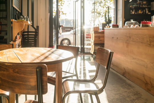 wooden table at an empty cafe in Toulouse in a sunny day nobody