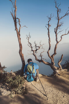 Young man looking at Ijen lake