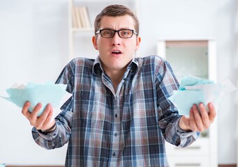 Young man frustrated at his house and tax bills