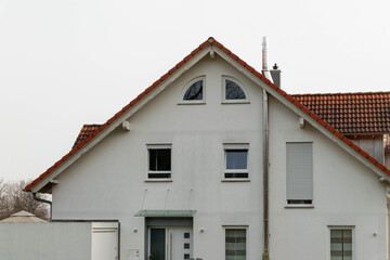 House facade with stainless steel chimney outside