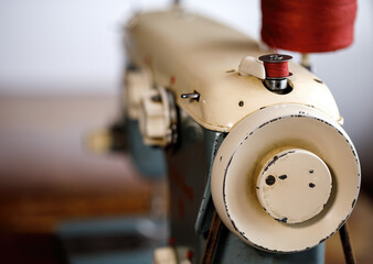 Retro German sewing machine. The process of winding the thread on the bobbin.