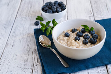 Porridge with blueberries. Fresh and healthy breakfast