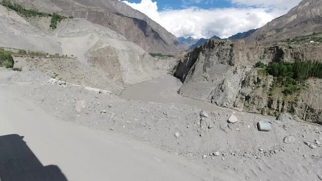 Driving along the river Indus on the Strategic Highway 1 (S-1) in Pakistan from Gilgit to Skardu in the Karakoram Mountain range