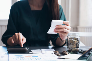 Accountant or banker calculate the cash bill.