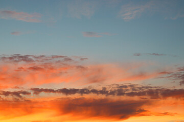 Obraz premium Beautiful sunset sky with clouds of orange and yellow. Natural background