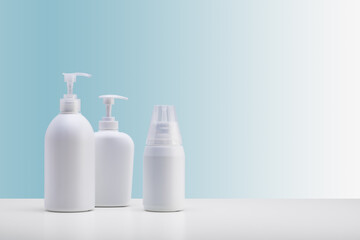 set of white cosmetic dispensers whit path