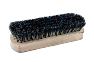 Wooden shoe brush on a white background.