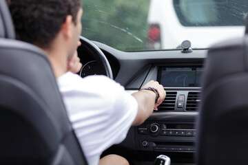 male driver putting navigation guide