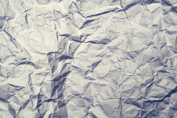 Gray crumpled shiny abstract paper background