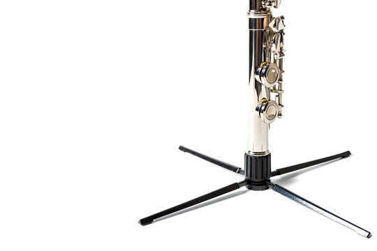 recommend clip art: woodwind flute, instrument on a stand on a light background