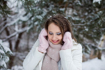 Woman look down and miles under the snow covered tree