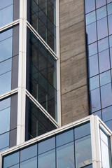 Blue and Brown modern building design with glass
