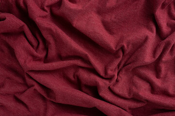 Crumpled linen cloth texture. Wrinkled textile. Red