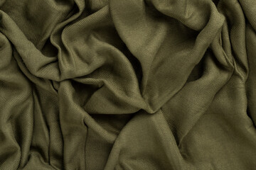 Crumpled linen cloth texture. Wrinkled textile. Green