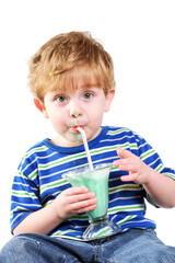 Messy young boy eating a frozen ice cream dessert