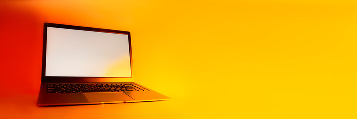 Slim modern laptop with white screen Mockup set against bright, red creative light.