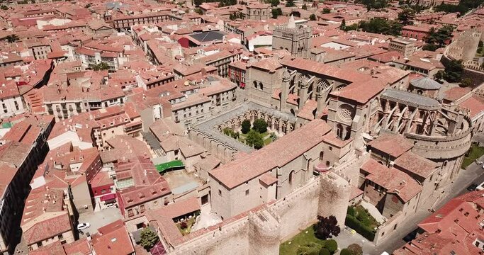 Aerial view of Gothic Cathedral of Saviour in Spanish fortified city of Avila on background of cityscape in summer day. High quality 4k footage