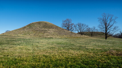 Series of small hills and trees form landscape at Cahokia Mounds State Park in Southern Illinois,...