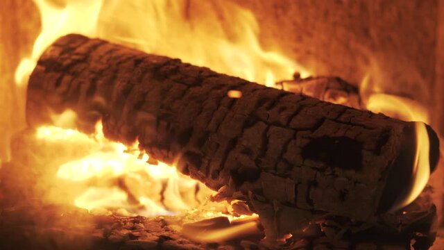 Burning Firewood Coal Close Up in the Fireplace. Fire Fireplace Ember Wood Home Embers Closeup. Glowing Embers in Hot Red Collor. Static Tripod Shoot.