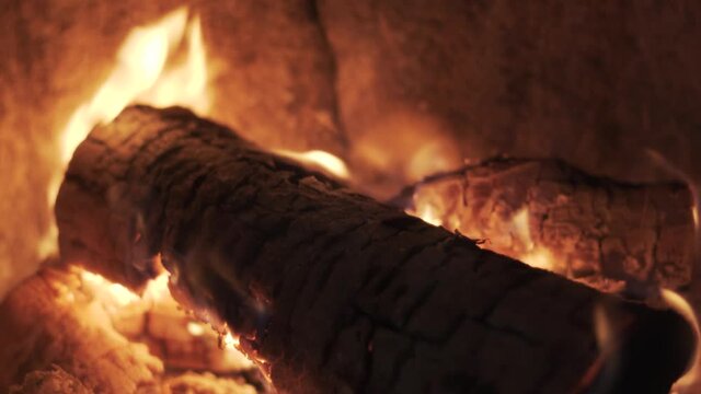 Burning Firewood Coal Close Up in the Fireplace. Fire Fireplace Ember Wood Home Embers Closeup. Glowing Embers in Hot Red Collor. Static Tripod Shoot.