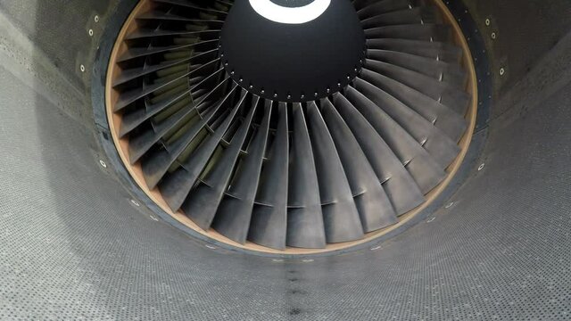 Widebody aircraft engine slowly turning in the wind.