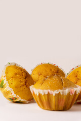 Four cupcakes on a plate on a white background