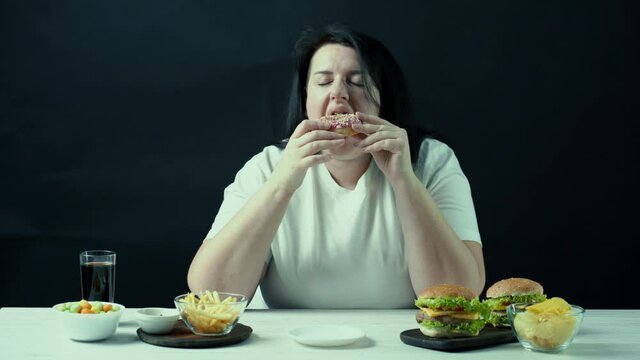 Woman on diet can't resist craving to eat tasty sweet doughnut. Food addiction, diet breakdown, compulsive overeating concept
