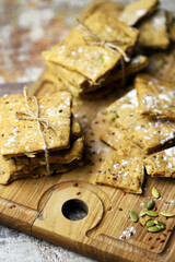 Selective focus. Homemade fitness cookies on a wooden board. Healthy biscuits with seeds.