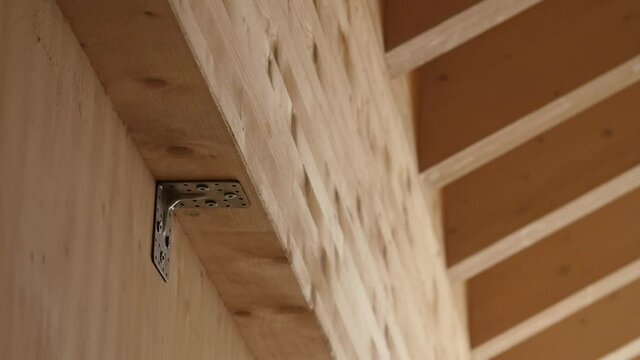 Detail of a mounting bracket in a wooden wall of new construction site house