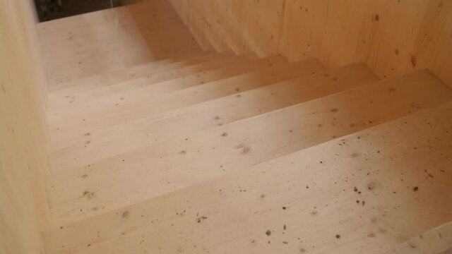 Travelling of new wooden staircases in a modern ecological constructions site