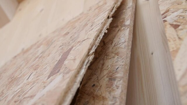 travelling of some Osb boards prepared for work in a new wooden building under constructiuon