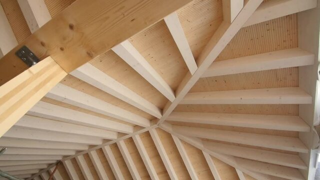 Travelling of a new wooden roof in a residential home with nice woodworking pattern