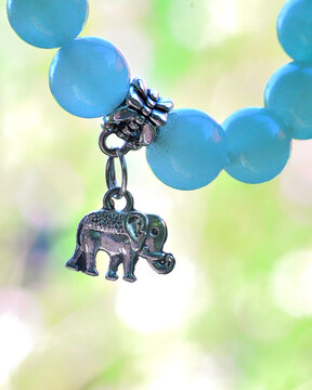 Natural stone bracelet with silver elephant pendant 