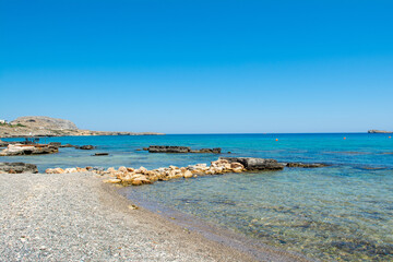 Fototapeta na wymiar Beautiful rocky beach on the shore of Mediterranean Sea