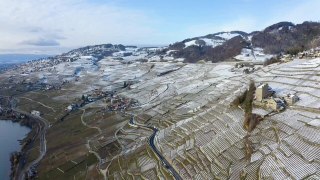 Medieval Tower Of Marsens In Lavaux Vineyard With Epesses And Riex Villages In Background During Winter In Vaud, Switzerland. - Aerial Drone Shot