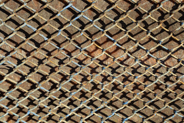 a close-up view of the mesh netting, in places already yellowed