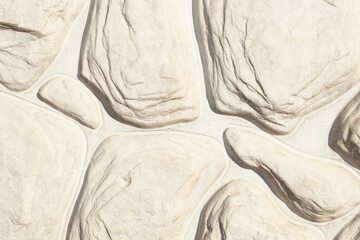 stones lie close to each other and repeat the bends of each other, which forms a pattern