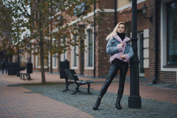 Fashion portrait of blonde girl in the city