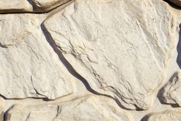 white stones of various sizes create a pattern