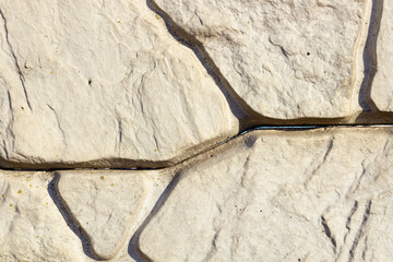 several deep cracks in white stones