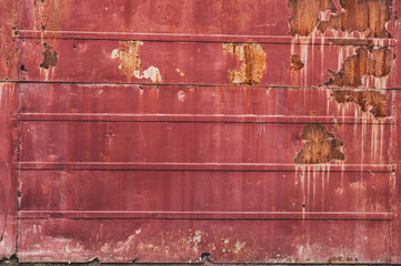 Vintage rusty metal background, cracked paint residues, rough textured metal surface, severe...